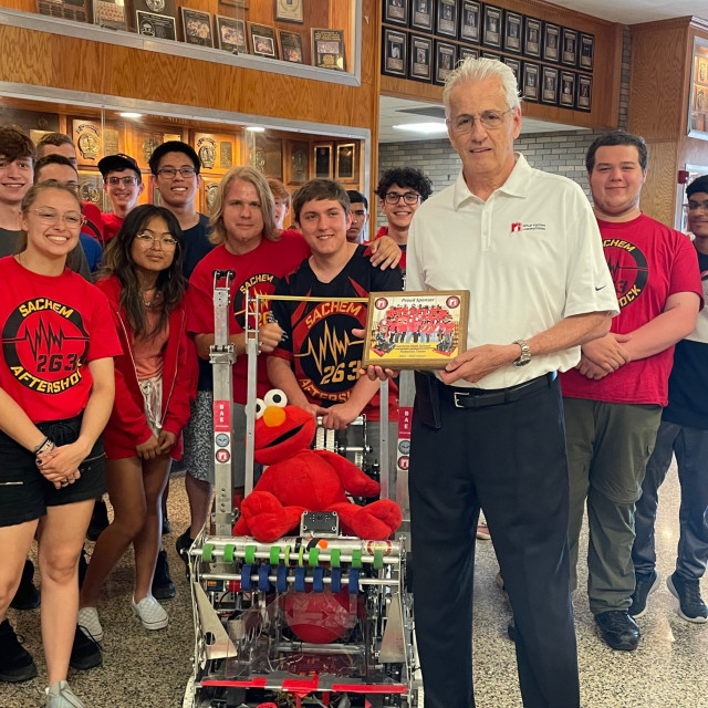 Retlif VP Bill Hayes receives plaque from students